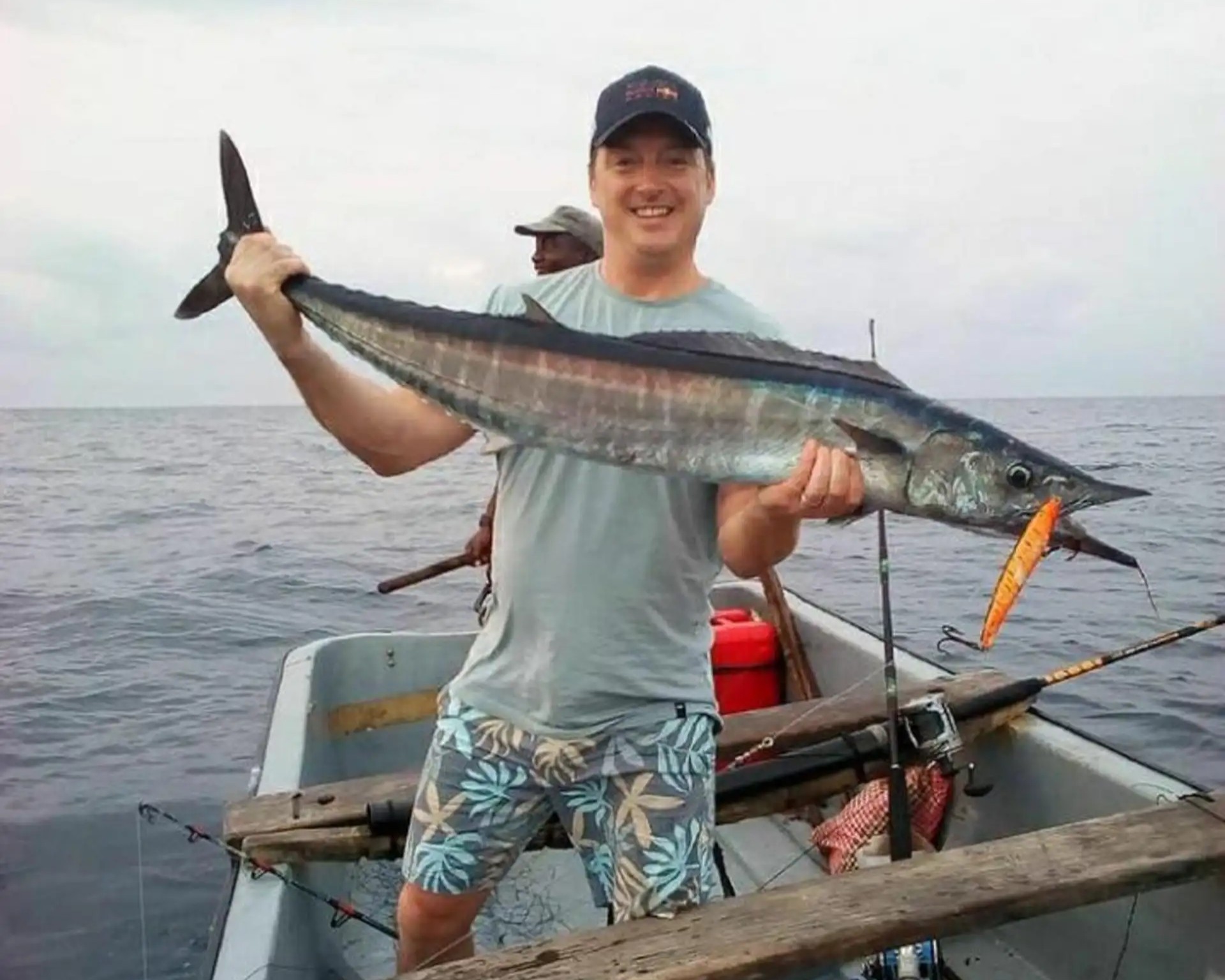 Experienced local fisherman guiding tourists on a deep-sea fishing expedition in Zanzibar