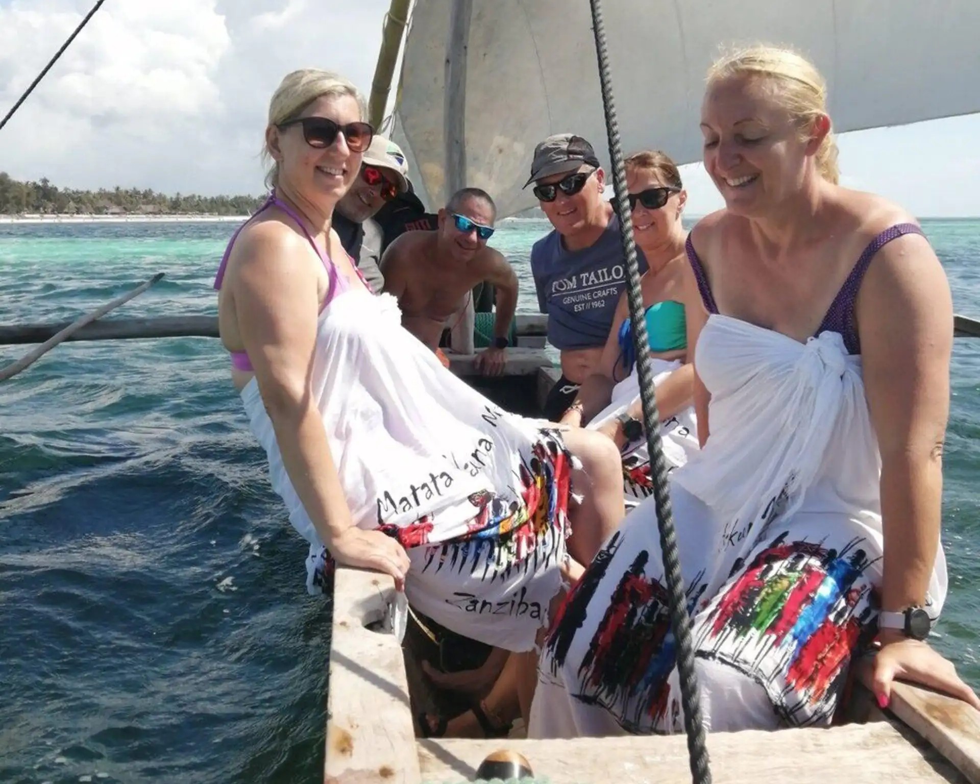 Traditional dhow sailing boat cruising in Zanzibar's crystal-clear waters